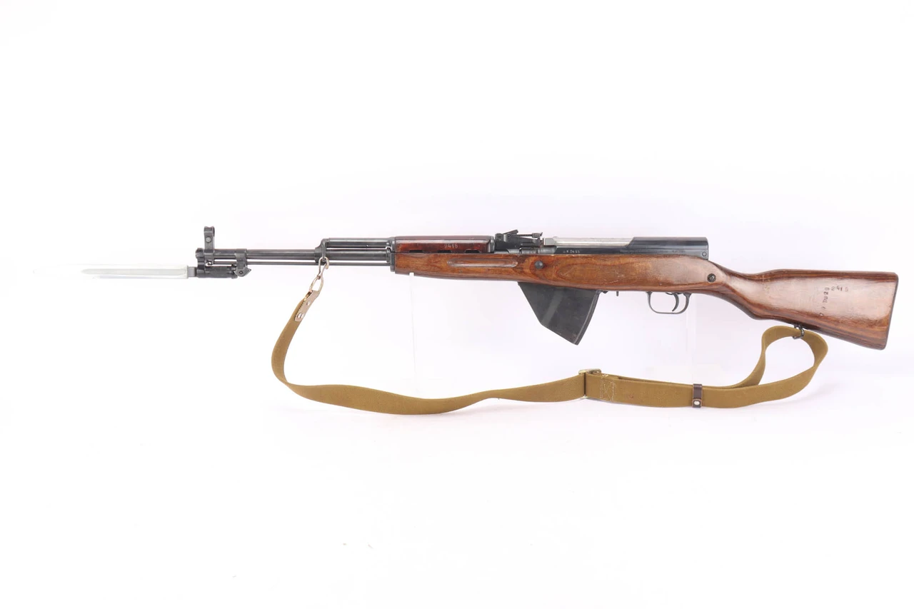1953 Russian Tula SKS 7.62x39 rifle - left side view with bayonet extended and sling