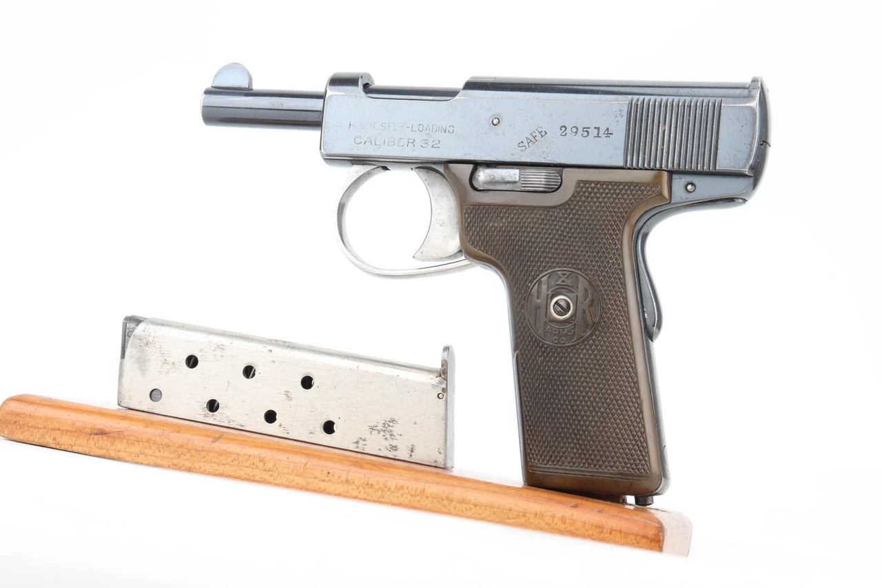 H&R .32 Self-Loading pistol left side with nickel magazine