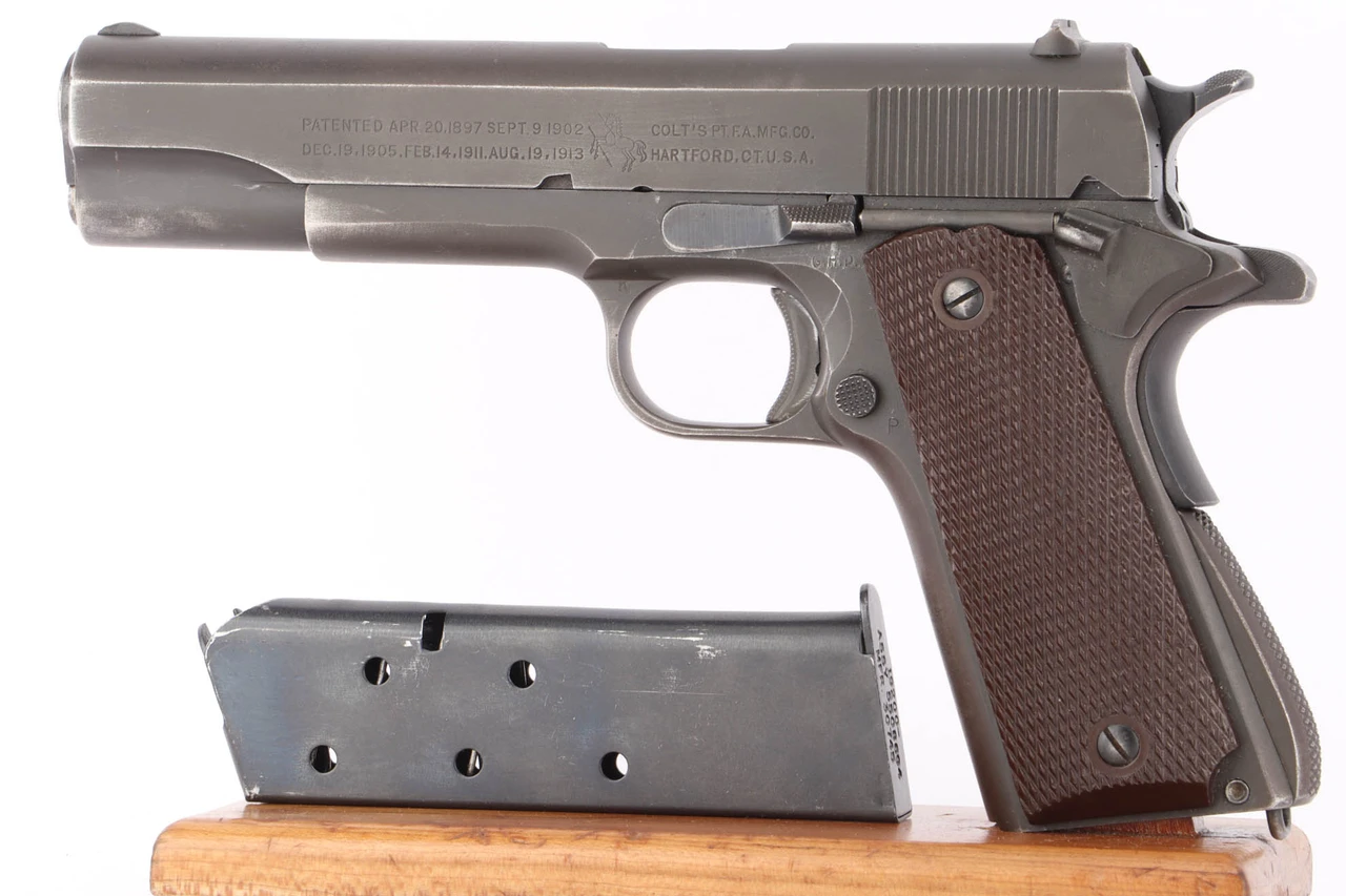 1943 Colt Model 1911A1 .45 ACP pistol left side with magazine