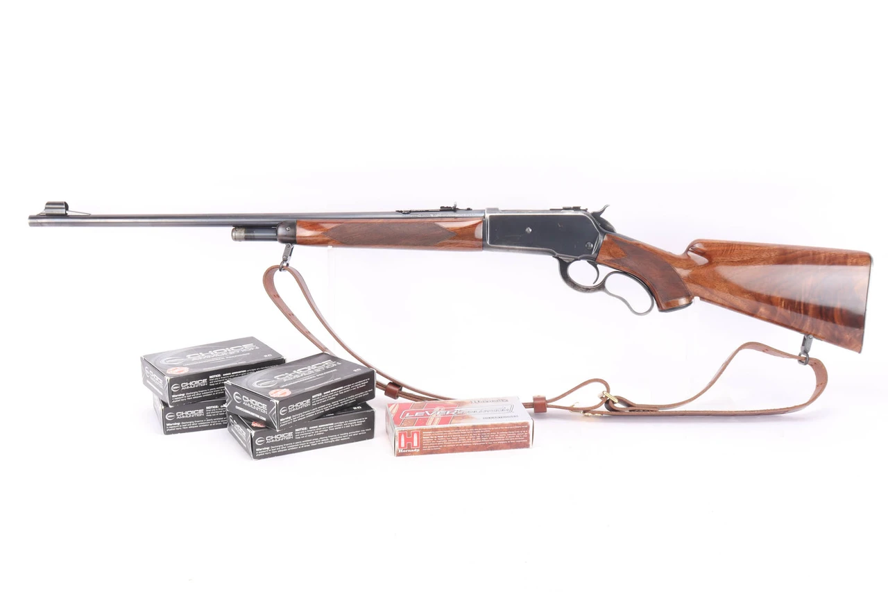 1936 Winchester Model 71 Deluxe .348 Win rifle - left side shown with sling and included ammunition