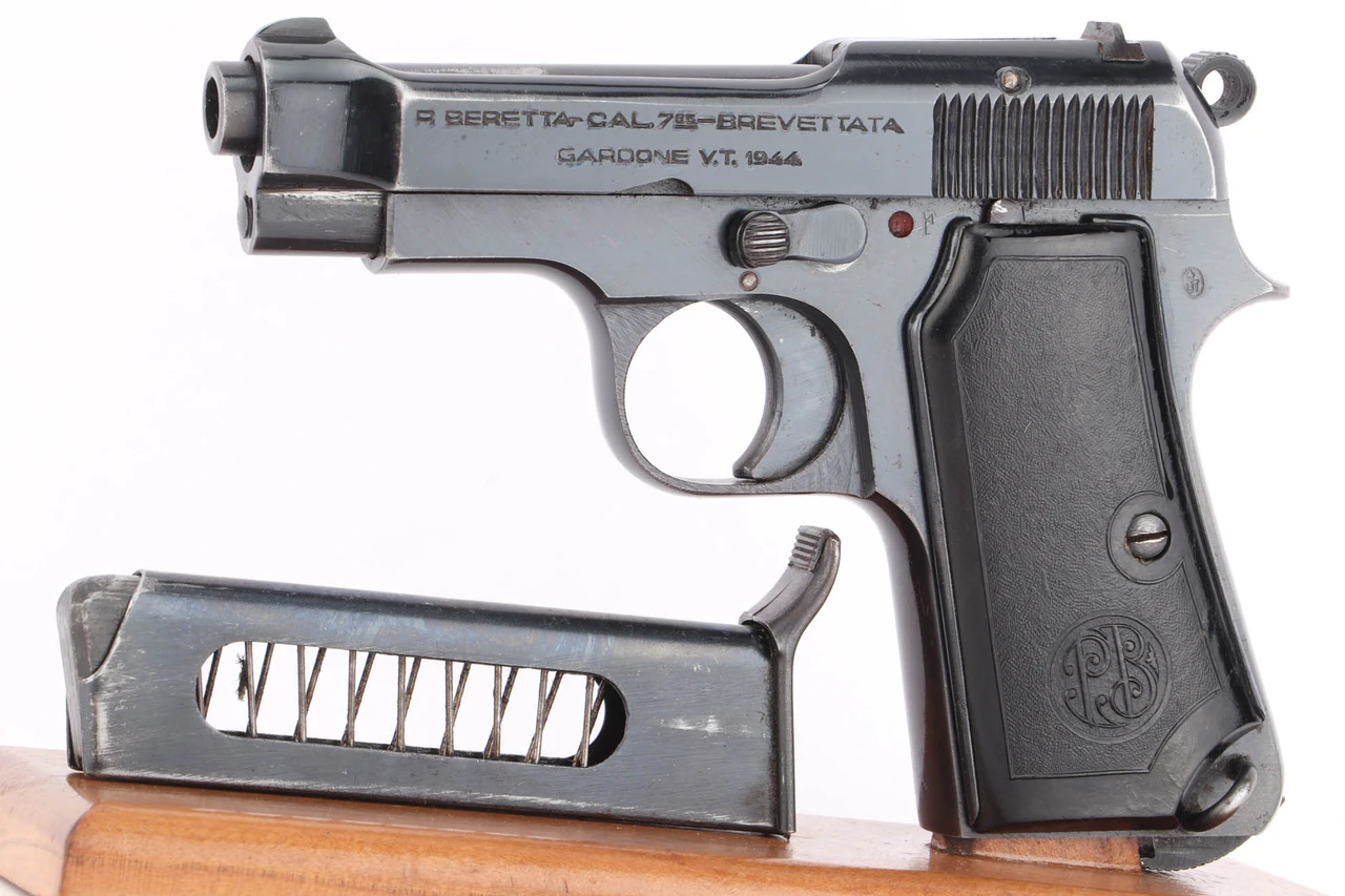1944 Nazi Beretta Model 1935 4UT 7.65mm pistol - left side view with magazine