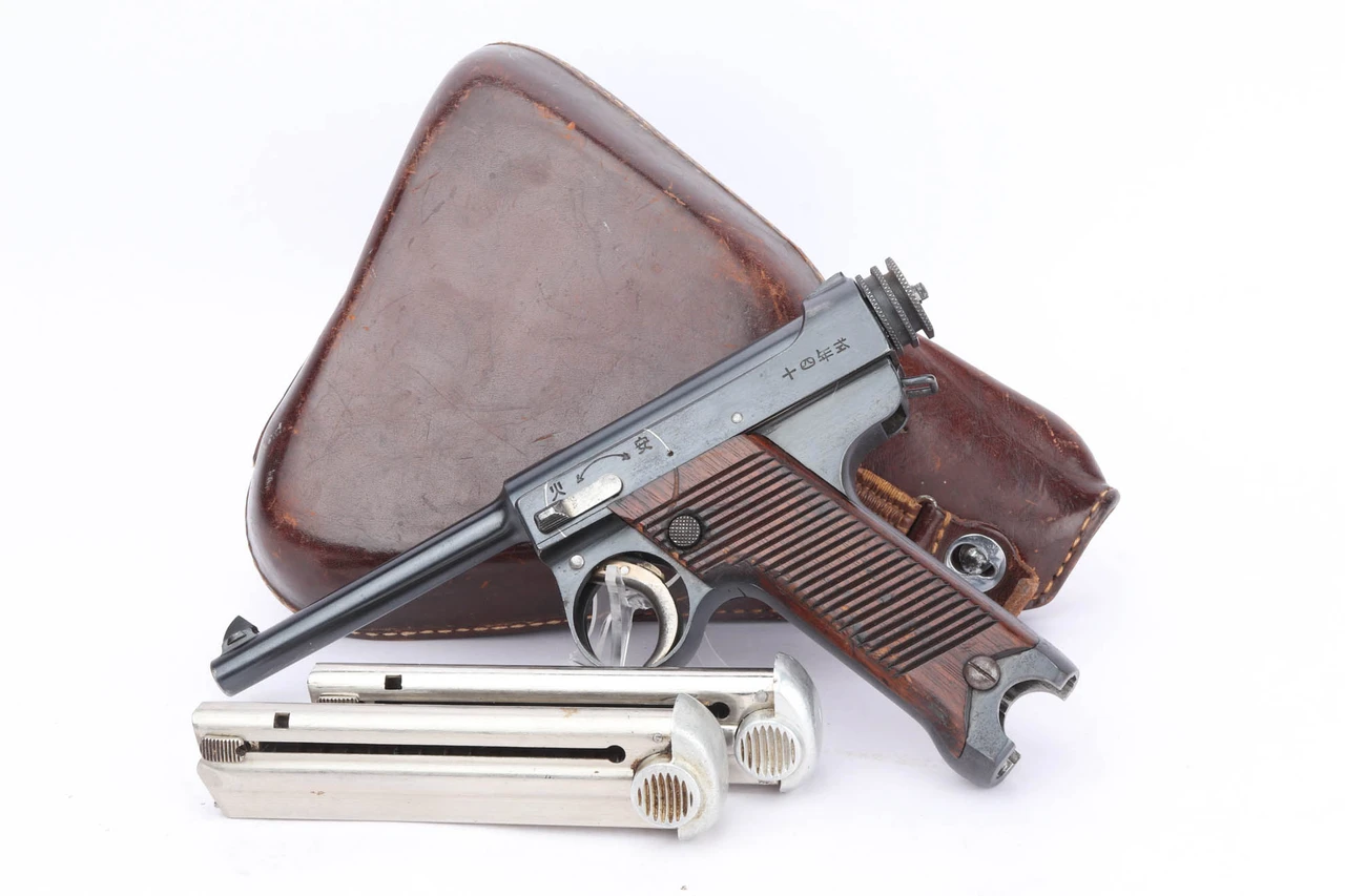 Early 1935 Nambu Type 14 rig with two magazines and leather clamshell holster