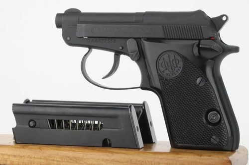 Beretta 21A Bobcat .22 LR pistol - left side with magazines
