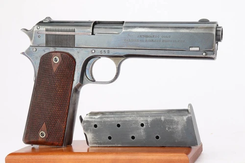 Colt Model 1907 U.S. military trials pistol - right side with magazine