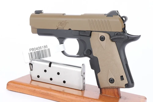Kimber Micro 9 with laser grips - left side with magazines