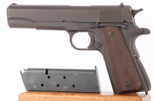 1943 Ithaca Model 1911A1 double stamped .45 ACP pistol - left side view with unmarked magazine