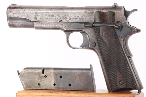 1918 US Army Colt Model 1911 .45 ACP pistol - left side view with two-tone Colt magazine