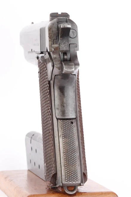 1943 Union Switch & Signal 1911A1 .45 ACP pistol - rear view of hammer and checkered mainspring housing