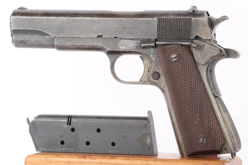 1943 Union Switch & Signal 1911A1 .45 ACP pistol - left side view with R marked magazine