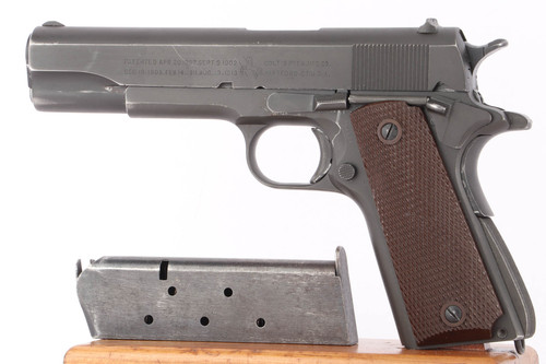 1944 Colt Model 1911A1 .45 ACP pistol - left side view with L marked magazine