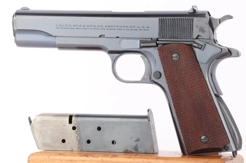 1930 Colt Government Model .45 ACP pistol - left side view with two-tone magazine