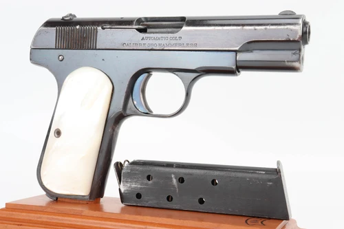 1912 Colt Model 1908 Pocket Hammerless .380 - right side profile with pearl grips and magazine