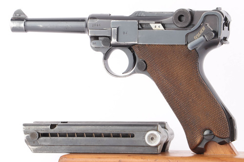 1940 Mauser Luger P.08 9mm pistol - left side view with checkered wood grips and matching magazine