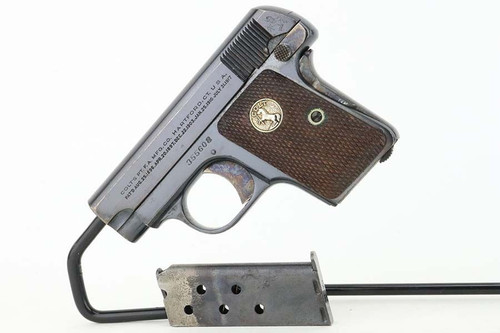 1926 Colt Model 1908 Vest Pocket .25 ACP pistol - left side view with magazine