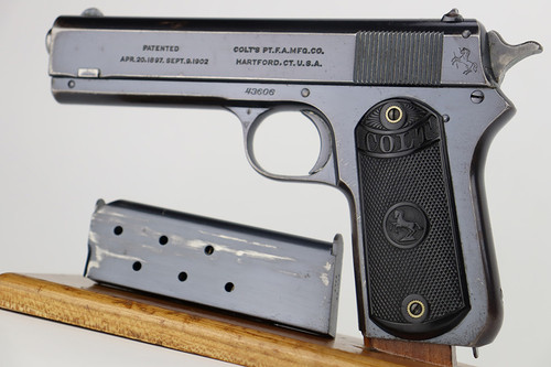 1921 Colt Model 1903 Pocket Hammer .38 - left side view with magazine