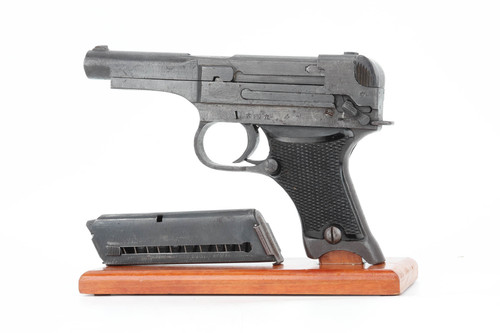 1944 Japanese Type 94 Nambu 8mm pistol - left side view with matching magazine