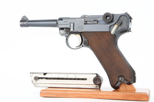 1916 DWM Luger 9mm P.08 pistol - left side view with period-correct magazine