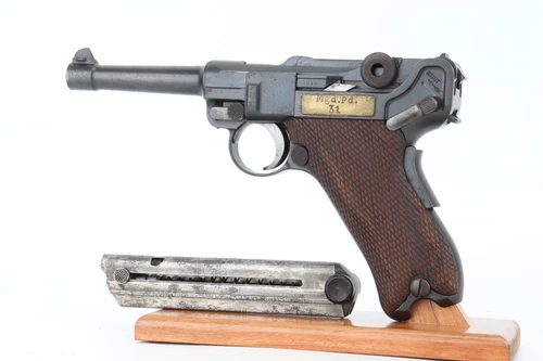 1913 Dutch East Indies DWM M.11 Luger 9mm - left side view with Mgd.Pd.31 plaque and magazine