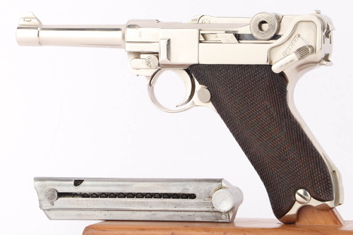 Left side of nickel plated 1920s commercial DWM Luger with magazine