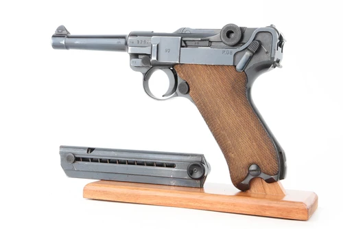 Left side of Ku marked Mauser Luger with blonde wood grips