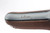 Unit marked DWM Sneak Luger - front grip strap unit marking close-up