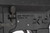 Aero Precision M16A4 style rifle with Nikon scope - left side lower receiver close-up