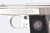 Nickel engraved Walther Model 9 6.35mm - close-up of floral filigree engraving and WW grip logo