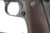 1944 Remington Rand M1911A1 .45 ACP pistol left side grip and trigger guard detail