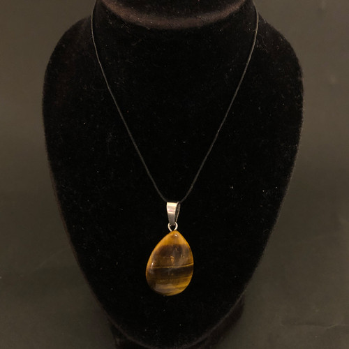 Tiger's Eye 33mm Teardrop Pendant on a black bust Tiger's Eye 33mm Teardrop Pendant on a black bust