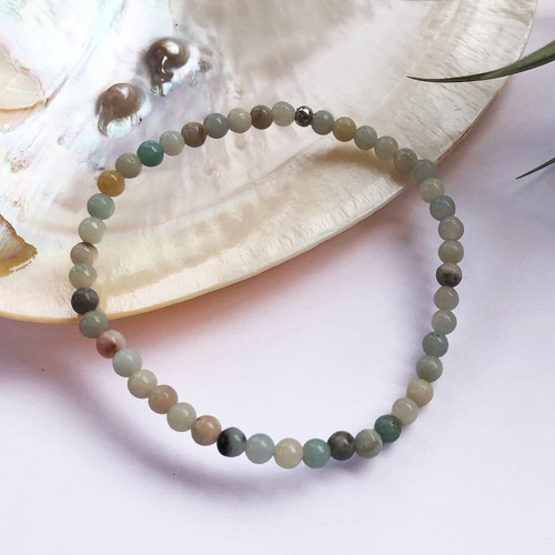 Flower Amazonite 6mm Bead Bracelet with shell and air plant behind