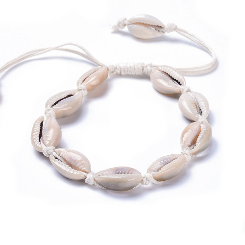 Off-white-natural cowrie shell anklet on a white background