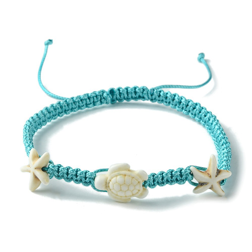 Adjustable Aqua Cord Bracelet with shell-coloured Howlite Starfish and Turtle beads on a white background