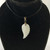 White Jade 24mm Carved Angel Wing Pendant with Stainless Steel bail on black cord