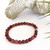 Red Purple Lepidolite 6mm bead bracelet on a white background.
