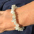 New Jade Chip bracelet on hand with navy linen behind