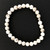 White Howlite 8mm Bead Bracelet - on black background