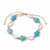 Cowrie Shell and Aqua Howlite Turtle adjustable bracelet on a white background