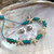 Howlite Starfish and Turtle with Aqua Bead Bracelet on shell