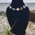 Amazonite Amethyst Crystal Chip and Freshwater Pearl Stainless Steel Anklet on black stand with air plant, rock and ocean behind