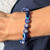 Evil Eye and Sodalite 8mm Bead Bracelet resting on hand
