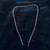 Diamond Cut Curb (Cuban or Rocker) Chain Necklace 60cm Stainless Steel showing 7mm wide curb link on black velvet background