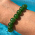 Green Nephrite Jade 8mm Bea Bracelet with pool behind