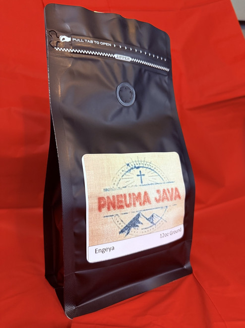 Bag of Pneuma Java Engeya coffee beans highlighting Ugandan Rwenzori origin and premium arabica craftsmanship. Bag of Pneuma Java Engeya coffee beans highlighting Ugandan Rwenzori origin and premium arabica craftsmanship.
