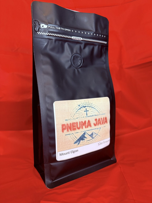 Bag of Pneuma Java Mount Elgon coffee beans showcasing Ugandan highland arabica origin and rich, smooth roast profile. Bag of Pneuma Java Mount Elgon coffee beans showcasing Ugandan highland arabica origin and rich, smooth roast profile.