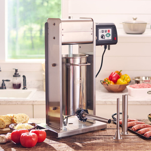 BigBite® 20lb Motorized Stuffer in a kitchen with Fruits & Vegetables