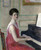 Woman At A Piano By Frederick Carl Frieseke By Frederick Carl Frieseke
