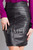 Close-up of the smooth, patterned full grain leather material texture of the ELLI skirt