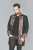 Detail of the lace tie and button fastening at the waist of the HARRING coat