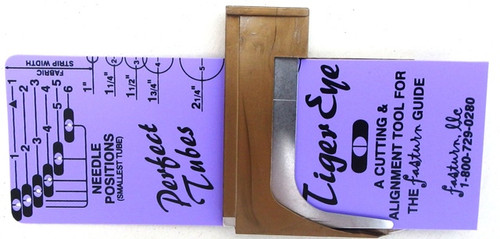 Guide & Tiger Eye
The Tiger Eye is an alignment and measurement tool all in one. The Tiger Eye assists with aligning the Guide and the Guide then allows you to sew perfect, uniform fabric tubes every time! Click here to see our video "How to use your Guide & Tiger Eye"