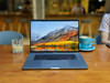 Refurbished The image displays a laptop with visible specifications on its screen indicating an Intel Core i7 processor and 16GB of RAM,